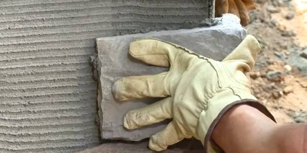 Install the artificial stone veneer onto the dried mortar surface.